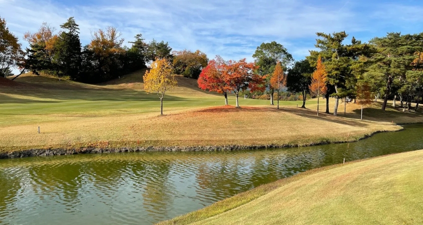 Kansai Golf in Autumn - Kyoto and Osaka Region Autumn foliage beside a water hazard on a Kansai golf course near Kyoto and Osaka