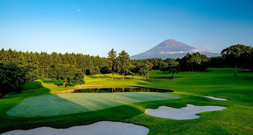 Golf With a Mount Fuji View - Tokyo + Fuji Region Golf course green with Mount Fuji in the background on a Tokyo and Fuji golf holiday