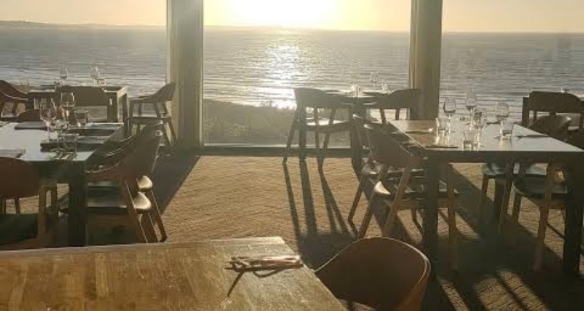 Lost Farm Restaurant at dusk overlooking the course and coastline at Barnbougle